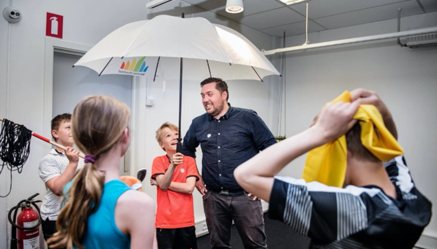 Designer and children participating in a design process at Play User Lab