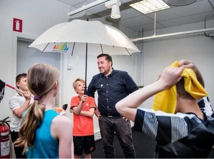 Designer and children participating in a design process at Play User Lab